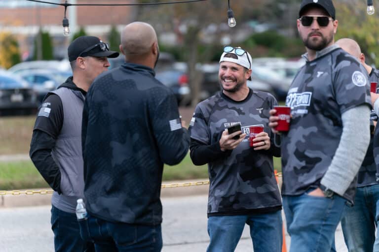 Participants interacting during the annual Mission 22 veteran support event.