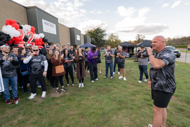 Large group of participants gathered outdoors during the Mission 22 annual event.